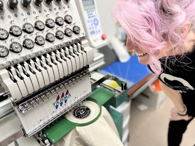 Member using an industrial embroidery machine